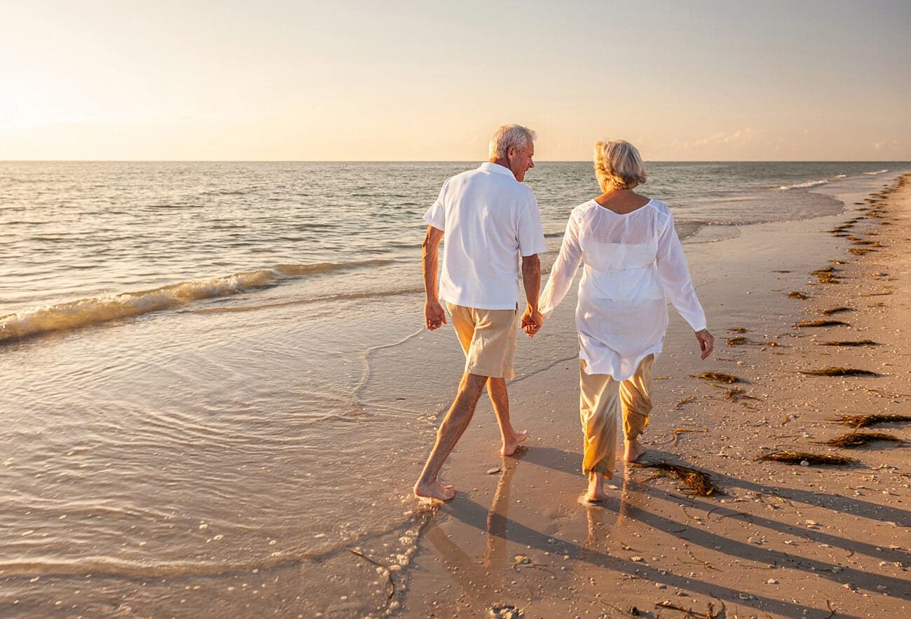 Couple walking on shoreline